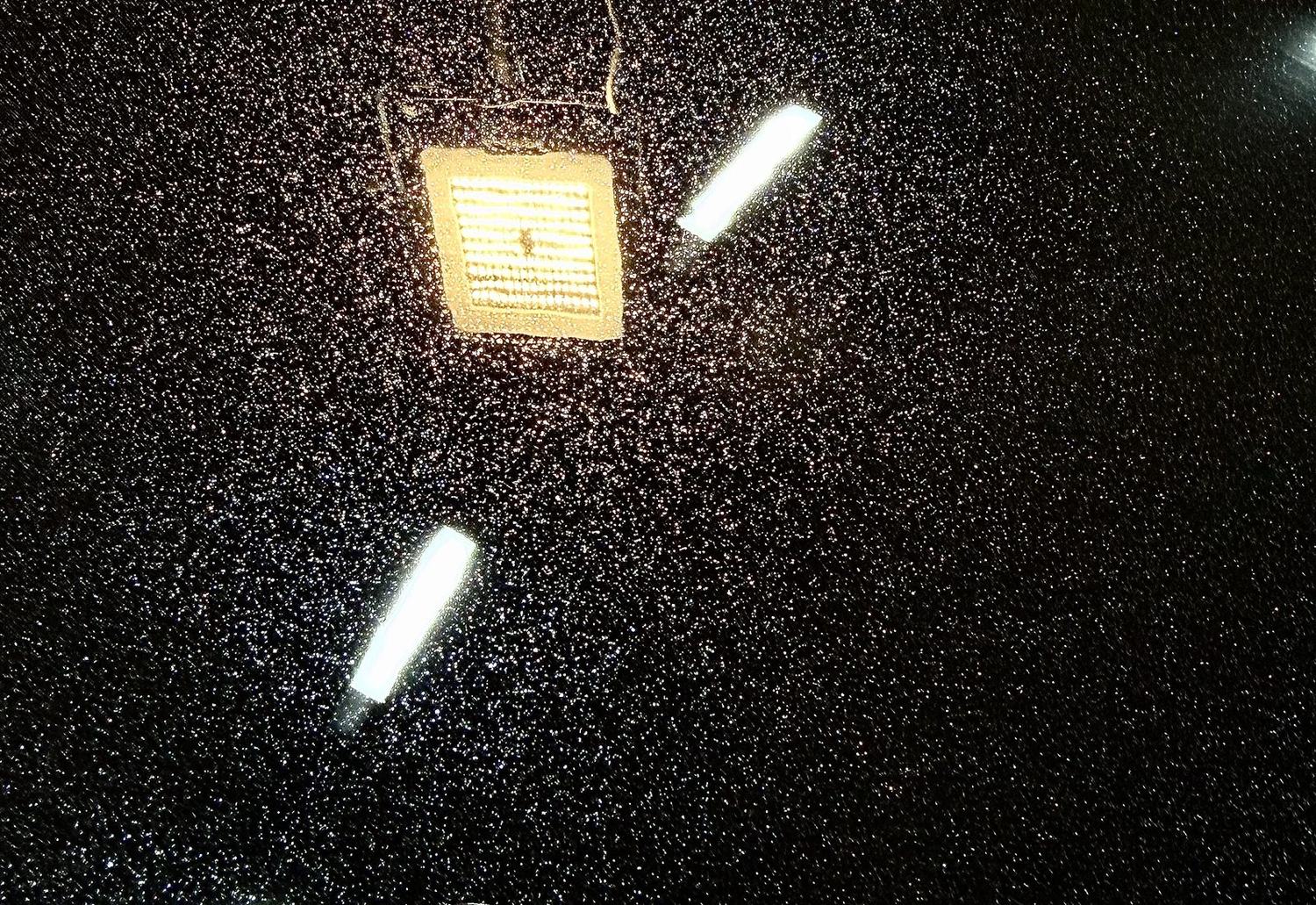 Water beading on a ceramic-coated panel at DSTNCT WERKS